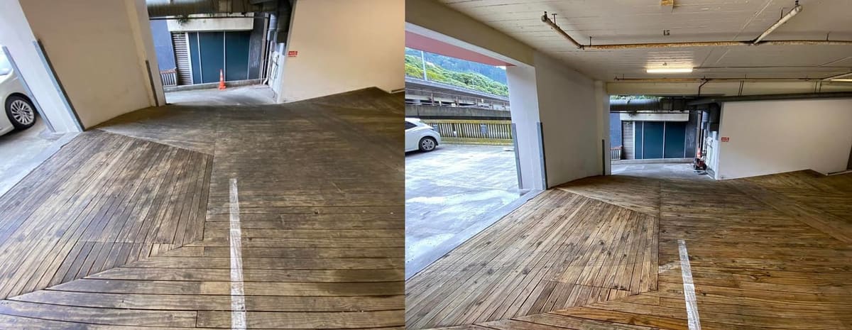 Wellington commercial cleaning at Quest Hotel on The Terrace, wide internal view of cleaned timber deck carpark with parking bay lines visible again, ready for guests after the deep clean.