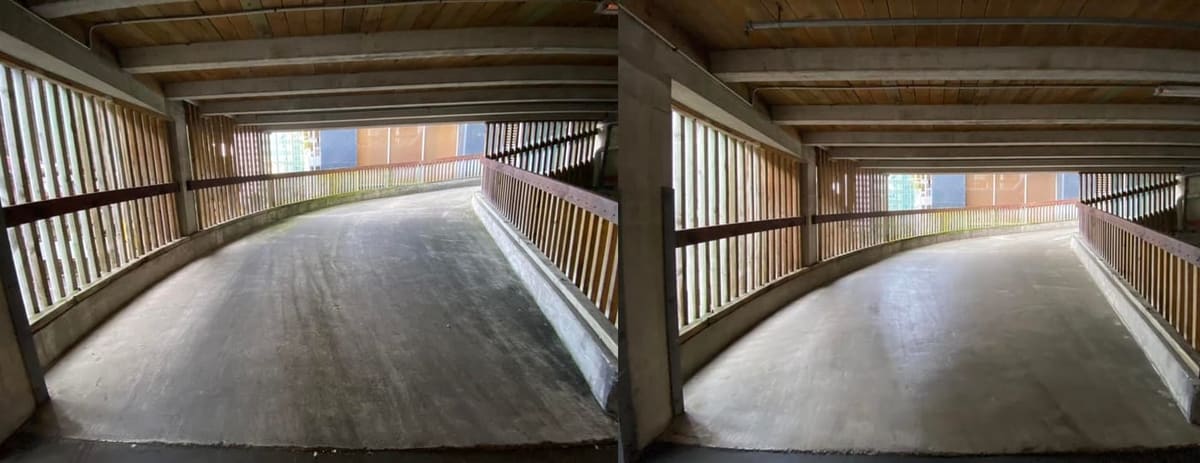 Wellington commercial cleaning at Quest Hotel on The Terrace, internal carpark ramp scrubbed of tyre marks, oil drip and moss film, returning an even pale concrete finish under the timber ceiling.