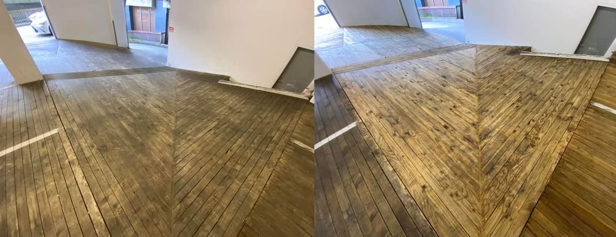 Wellington commercial cleaning at Quest Hotel on The Terrace, detailed view of timber deck planks in the carpark before and after softwash, showing the dramatic colour lift across the grain.