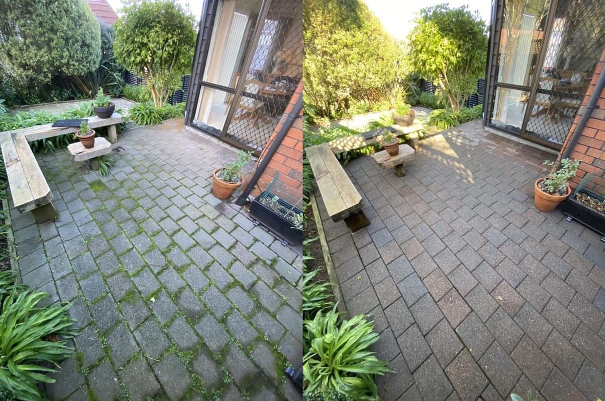 Patio cleaning in Wellington, brick paver patio with a stone bench, moss and algae in joints before, clean restored paving after