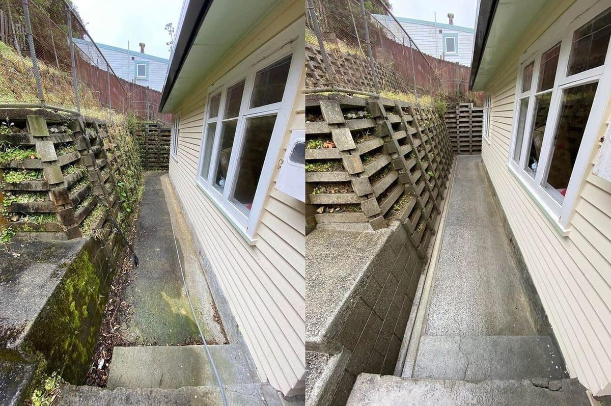 Path cleaning in Wellington, concrete side path between a house wall and a lattice concrete retaining wall, mossy before, clean dry concrete after