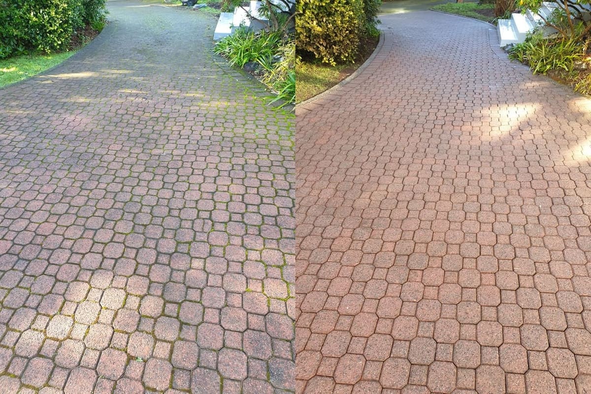 Driveway cleaning in Karori, before and after, concrete or paver driveway lifted from mossy grey to clean restored surface