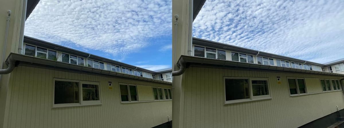 Wellington school gutter cleaning at Newlands College A Block, long courtyard run of spouting cleaned of moss, leaf litter and silt, photographed across the inner classroom courtyard.