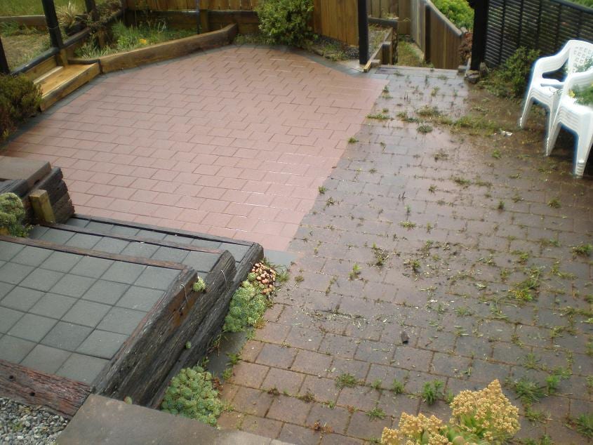 Patio cleaning in Paparangi, before and after, paver or brick surface restored from weathered grey to clean original colour