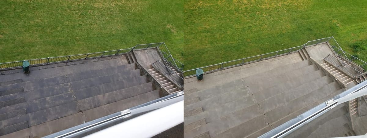 Wellington school exterior cleaning at Newlands College, overhead view of concrete stadium seating across from the field, heavy black mould and algae stripped to reveal even pale concrete.