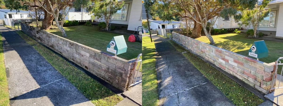 Retaining wall cleaning in Korokoro, before and after, wall blasted clean of algae and grime to restored finish
